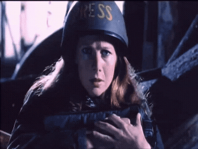 Man In US Helmet Talks To Woman GIF