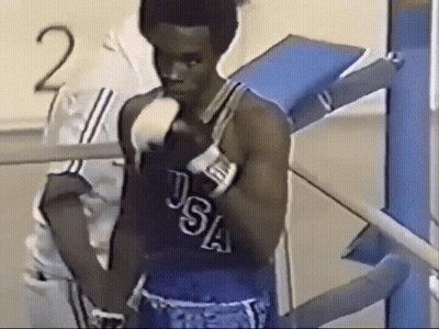 Man In USA Boxing Uniform Standing In Front Of Number 2 GIF