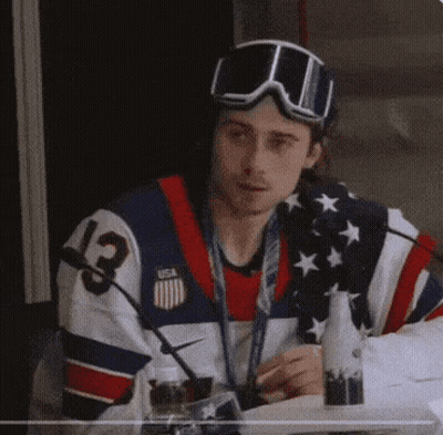 Man In USA Jersey And Goggles Sitting GIF