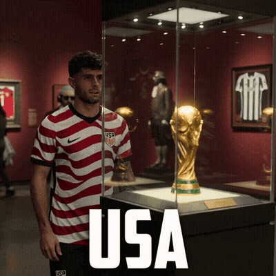 Man In USA Jersey In Front Of Trophy GIF
