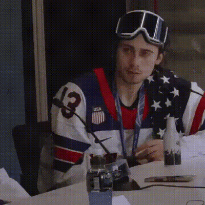 Man in USA Jersey Sitting at Table