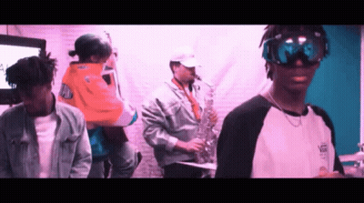 Man In Vans Shirt Playing Saxophone GIF