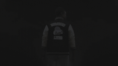 Man In Varsity Jacket Giving OK Sign GIF