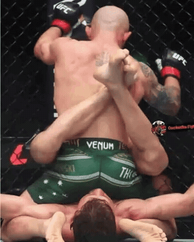 Man In Venom Shorts Wrestling Another Man In Ring GIF