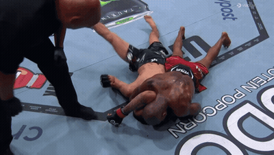 Man In Venum Shorts Laying On Ground GIF