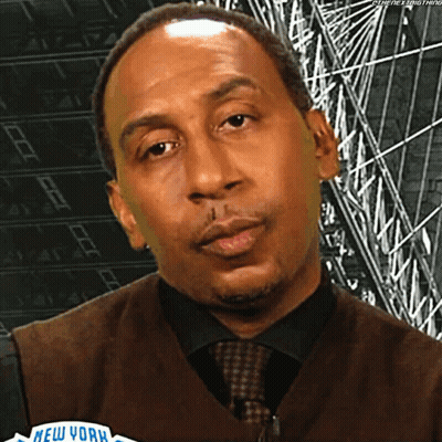Man In Vest And Tie Before New York Sign GIF
