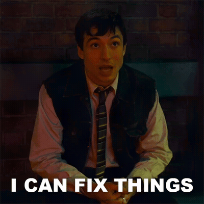 Man In Vest And Tie Beside I Can Fix Things Sign GIF
