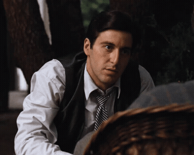 Man In Vest And Tie Looking Down GIF