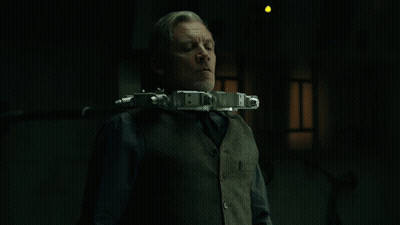Man In Vest And Tie With Gun Neck Device GIF