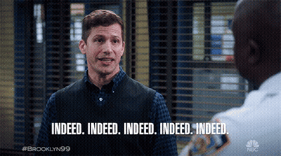 Man In Vest Saying Indeed GIF