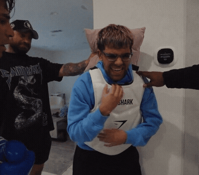 Man In Vest Saying Shark Smiling GIF