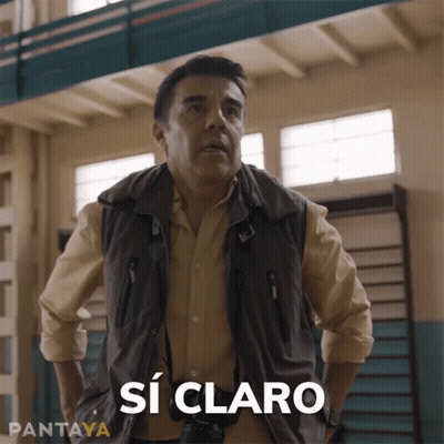 Man In Vest Saying Si Claro GIF