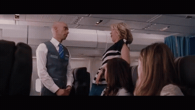 Man In Vest With Word Steward GIF