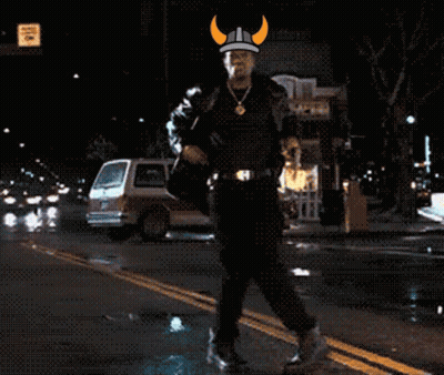Man In Viking Hat Walking Down Street GIF