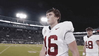 Man In Vikings Jersey Holding Hand To Head GIF