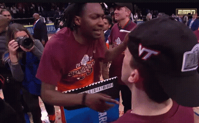 Man In Virginia Tech T-Shirt Talking To Another Man GIF
