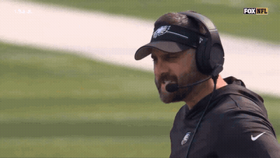 Man In Visor And Headphones With Fox NFL Logo GIF