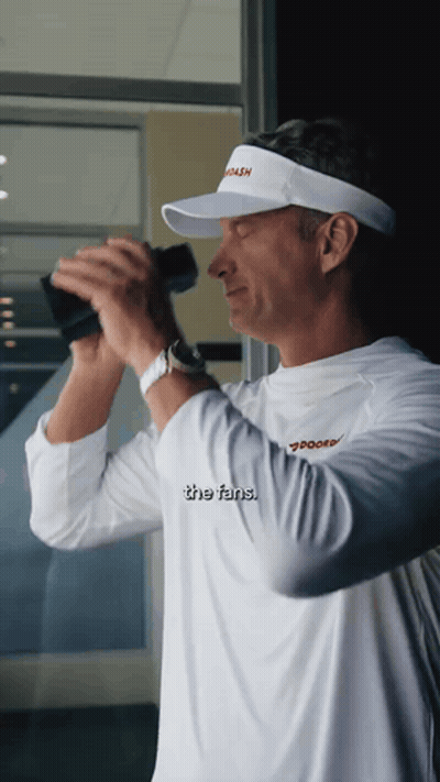 Man In Visor Saying Coach Looks Through Binoculars GIF