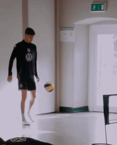 Man In Volkswagen Shirt Kicking Ball GIF