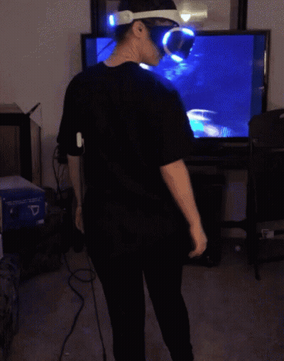 Man In VR Headset Sitting In Front Of TV GIF
