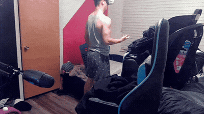 Man In VR Headset With Blue Chair GIF