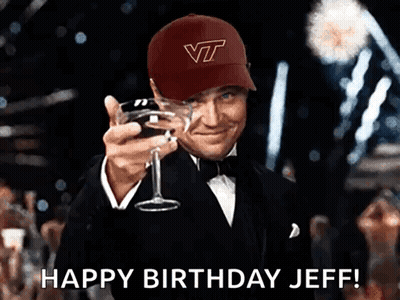 Man In VT Hat Holding Wine Glass GIF