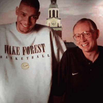 Man In Wake Forest Shirt Next To Man With Glasses GIF