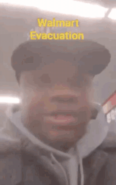 Man In Walmart Evacuation Hat Making Funny Face GIF