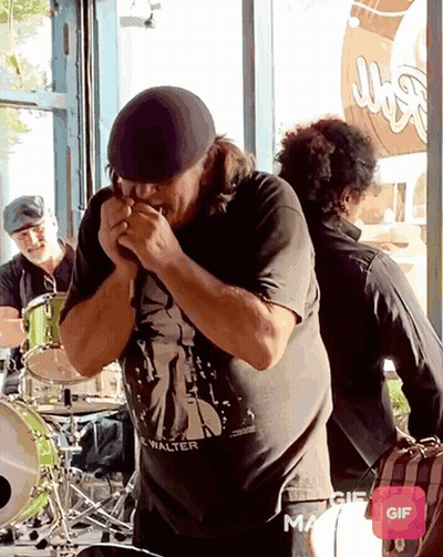 Man In Walter Shirt Playing Harmonica GIF