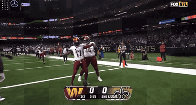 Man In Washington Football Jersey Holding Football GIF