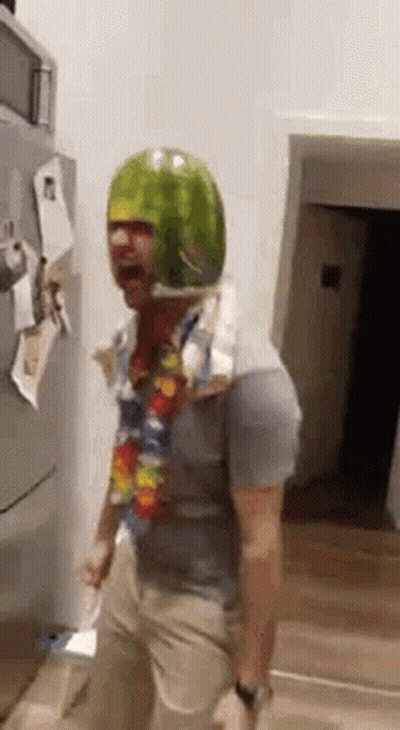 Man in Watermelon Helmet Dancing