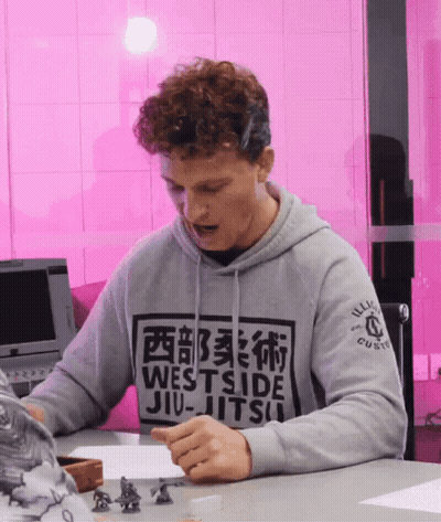 Man In Westside Jiu-Jitsu Hoodie Sitting At Table GIF