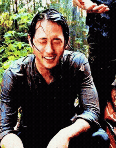 Man In Wet Shirt Smiling Looking Down GIF