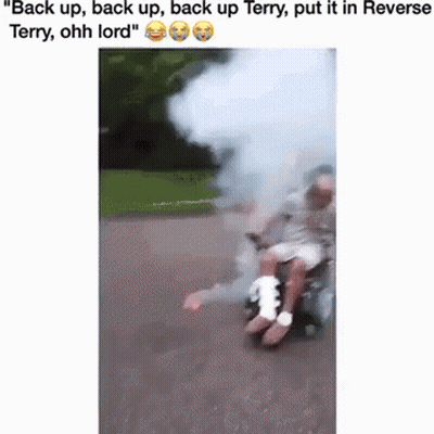 Man In Wheelchair With Bandage Pushed By Another Man GIF