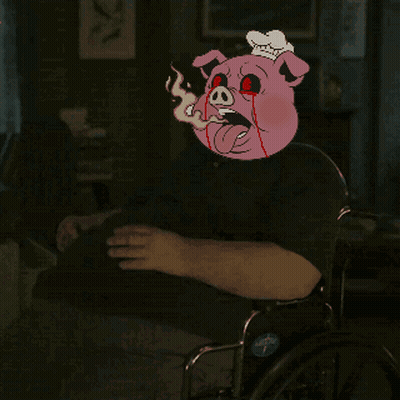 Man In Wheelchair With Cartoon Pig On Head GIF
