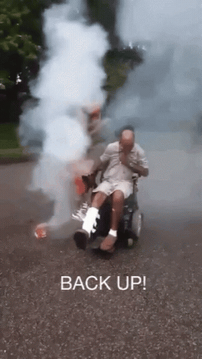Man In Wheelchair With Cast Smoking GIF