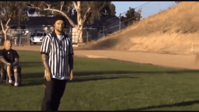Man In Wheelchair With Referee In Striped Shirt GIF