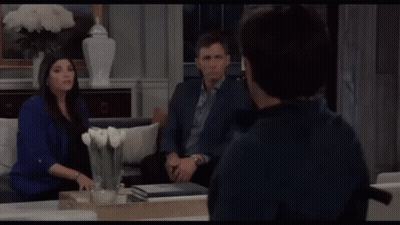 Man In Wheelchair With Two People In Living Room GIF
