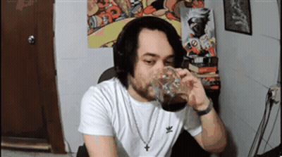 Man In White Adidas Shirt Drinking From Cup GIF