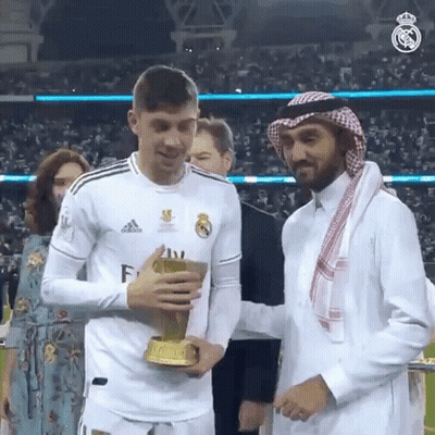Man In White Adidas Shirt Holding Trophy GIF