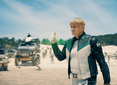 Man In White And Green Jacket With Letter O GIF