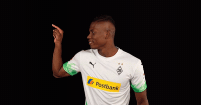 Man In White And Green Postbank Jersey Pointing Up GIF