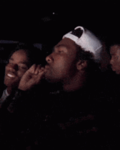 Man In White Baseball Cap Sitting Next To Woman GIF