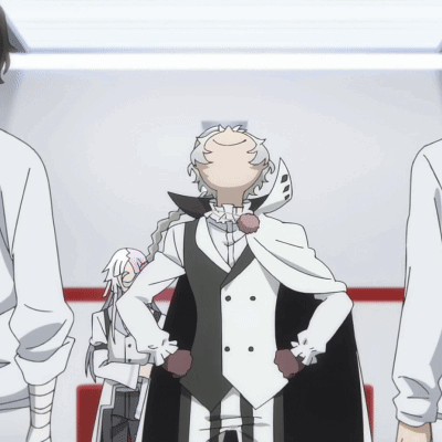 Man In White Coat And Black Vest Standing In Room GIF