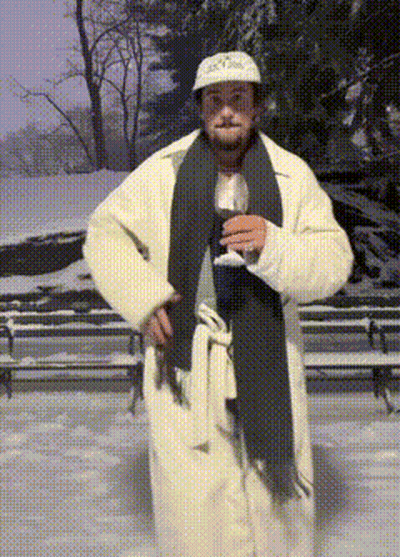 Man In White Coat And Scarf Holding Wine GIF