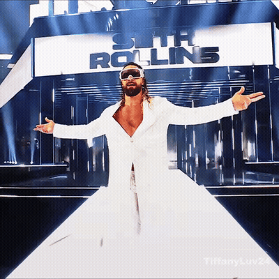 Man In White Coat And Sunglasses At Seth Rolling Sign GIF