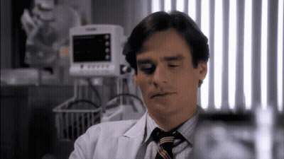 Man In White Coat And Tie At Monitor GIF
