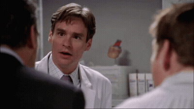 Man In White Coat And Tie Talking To Two Men GIF