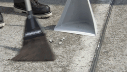 Man In White Coat Doing Sweep In The Street GIF