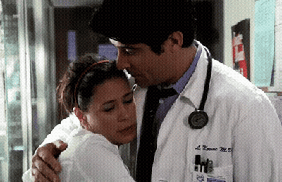 Man In White Coat Hugging Woman With Stethoscope GIF